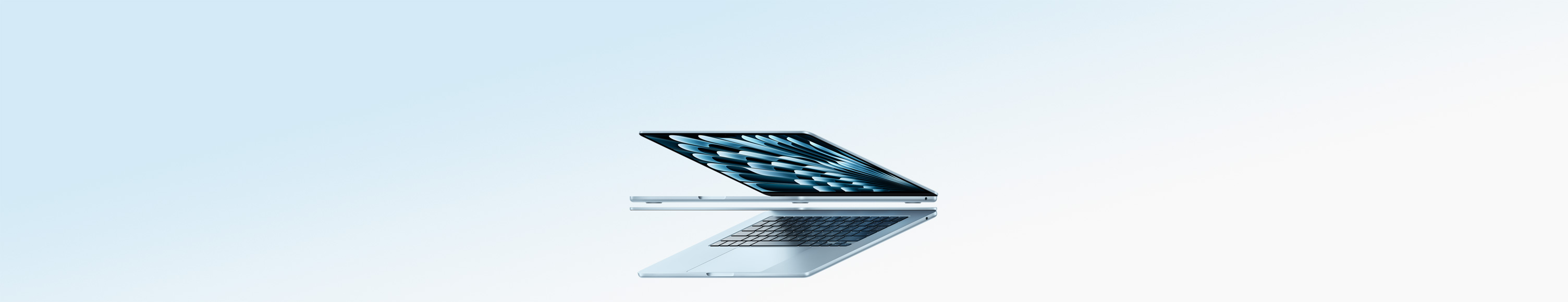 兩部打開的天藍色 MacBook Air 手提電腦合組成箭嘴形狀，突顯纖薄外觀