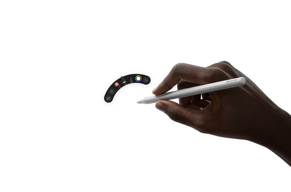 iPad Air elölnézetből, egy kéz Apple Pencil Prót tart, a felhasználó egy kézírásos jegyzeteket tartalmazó illusztráción dolgozik a Procreate-ben