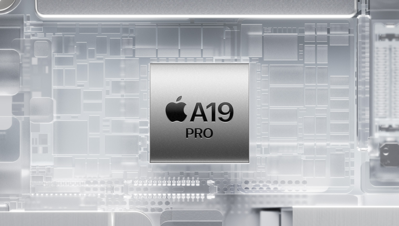 Un chip A19 Pro rodeado de los componentes internos brillantes de un iPhone